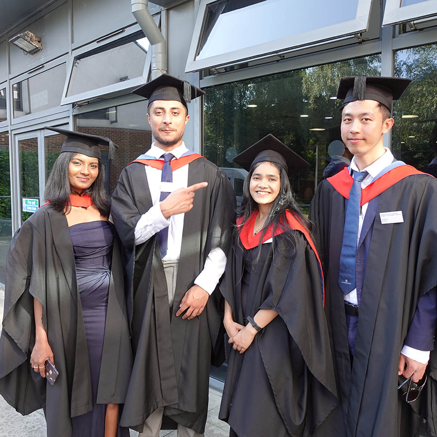 HND Computing graduating students posing for a photo in their caps and gowns at the HE Graduation ceremony 2025.