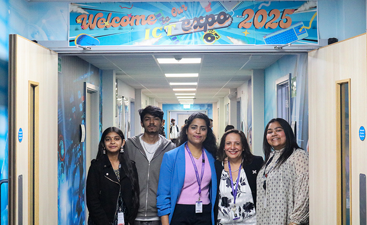 ICT Harrow staff and students standing in a group and smiling at the camera below a sign that says 'Welcome to our ICT expo 2025'.